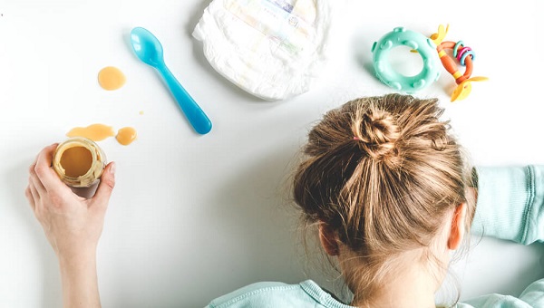 lifestyle tired mother top view on white background