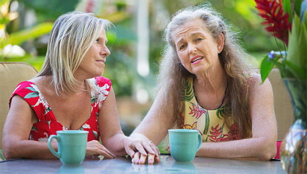 Two women are meeting for coffee and conversation.