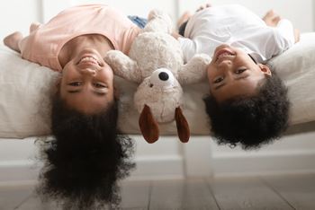 two kids hanging upside down