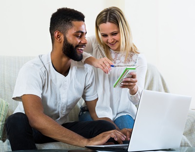 A couple makes a to-do list together.