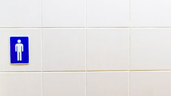 A men's restroom sign at the entrance to the restroom