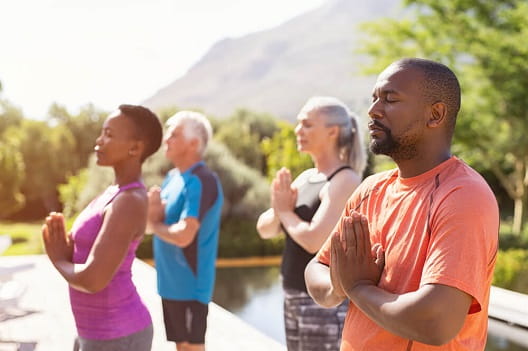 A group of people practicing yoga