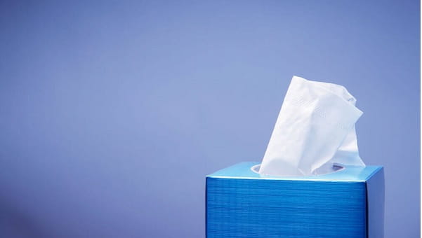 Tissue box on blue background
