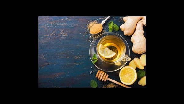 collage of ginger, lemon, honey and a glass of tea