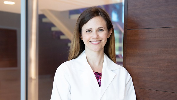 Photo of Dr. Waters standing in a hospital lobby