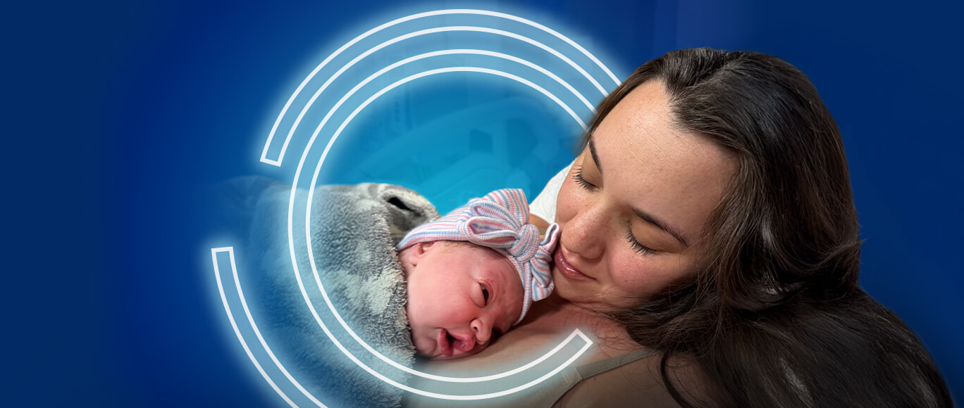 image of a woman holding a newborn baby