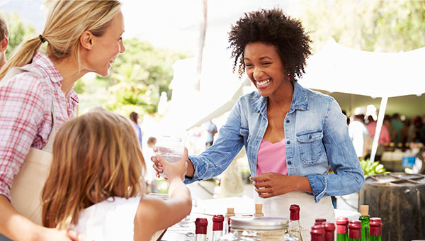 farmers market vendor with customer farmers market vendor with customer