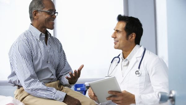 Male patient talking to male doctor