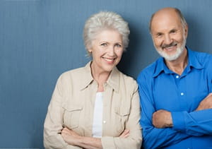 A senior female and senior male volunteer