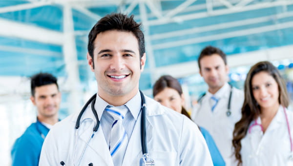 Doctors standing in an office.