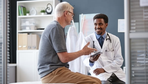 Male patient speaking to doctor