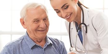 A male patient talks with a female doctor