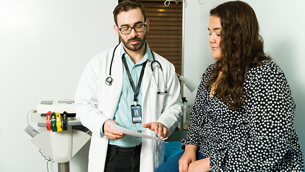 A patient having a consulative visit with their healthcare provider