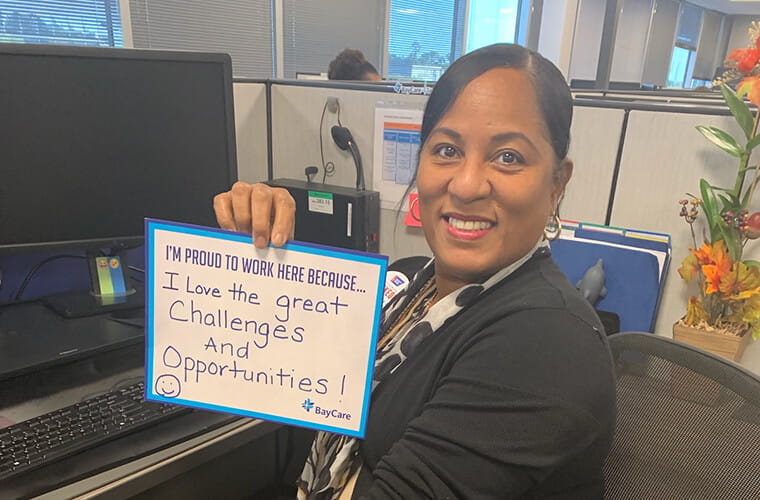 BayCare team member holding testimonial sign