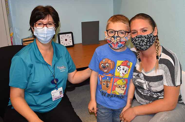Lisa O’Hanlan, speech language pathologist, pictured here with Allen Walker and his mother, Tanika Six