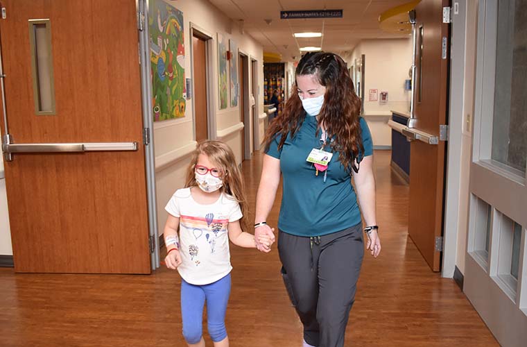 BayCare Child Life Specialist Brianna Wagner with 6-year-old pediatric patient.