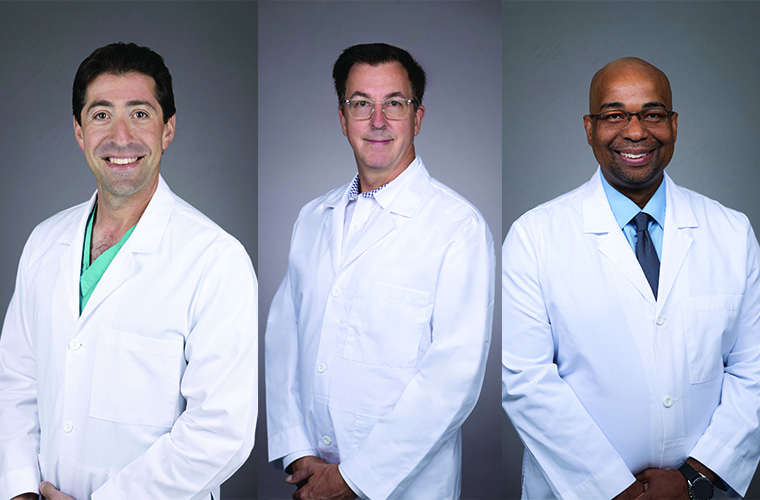 Three neurosurgeons in lab coats pose for pictures.