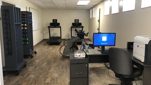 The workout room with a computer and various exercise equipment used for the Personalized Exercise Prescription Program, part of the Morton Plant Mease Family Medicine Residency.