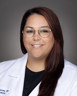 Dr. Haily Radziseski's headshot wearing a lab coat 
