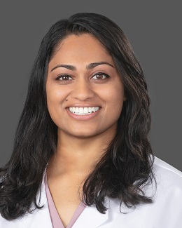 Dr. Amy Grace Pothen's headshot wearing a lab coat 