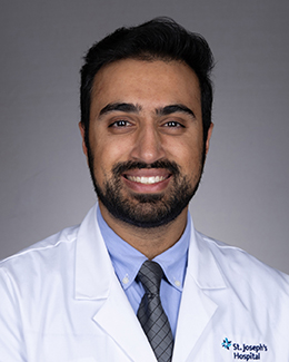 Pranit Singh's headshot in a labcoat
