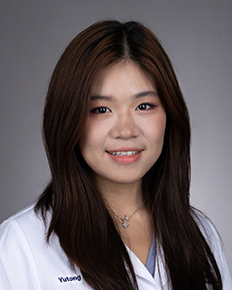 Yutong (Crystal) Li's headshot in a lab coat