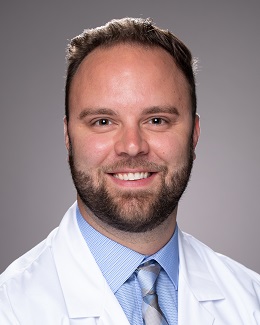 A headshot photo of Adam Brzezinski, MD.