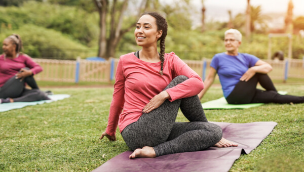 Women doing yoga outside