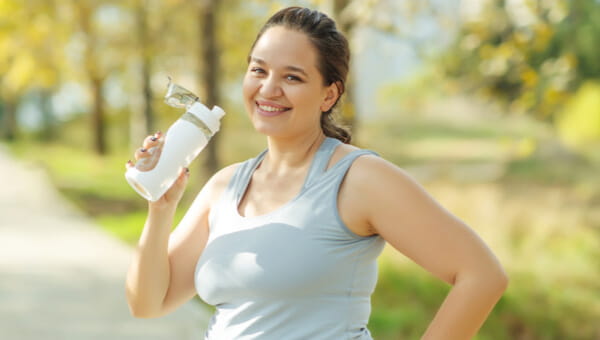 Girl working out drinking water