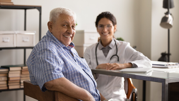 MPNBH Meet Our Team Male sitting with a bariatrics professional