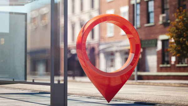 A large location icon in a city setting