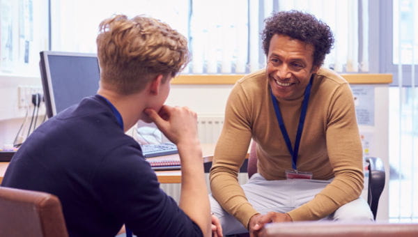 Learn more about BayCare behavioral health services. Male meeting with a male counselor discussing mental health issues