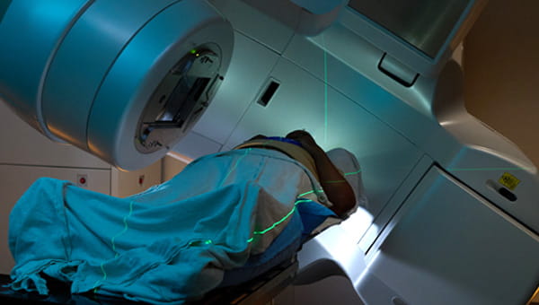 a patient lying on a table while getting radiation therapy