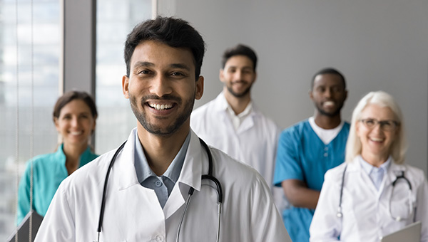 Group of doctors smiling at the camera.