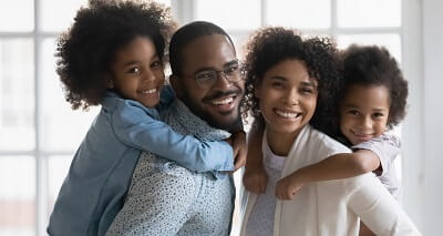 A father, mother and their two young daughters