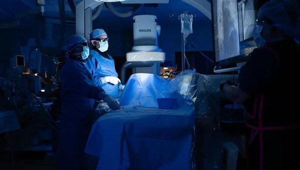 An image of two providers in the pediatric cardiac catheterization lab.