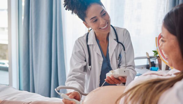A doctor taking a sonogram test of an unborn child
