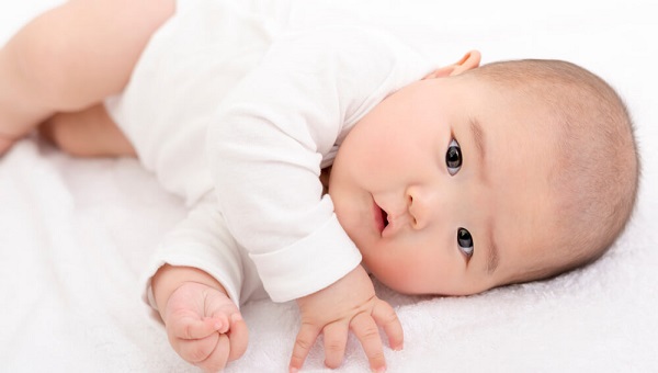 Rolling over baby on the bed