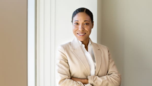 Confident African American business woman smiling at work.